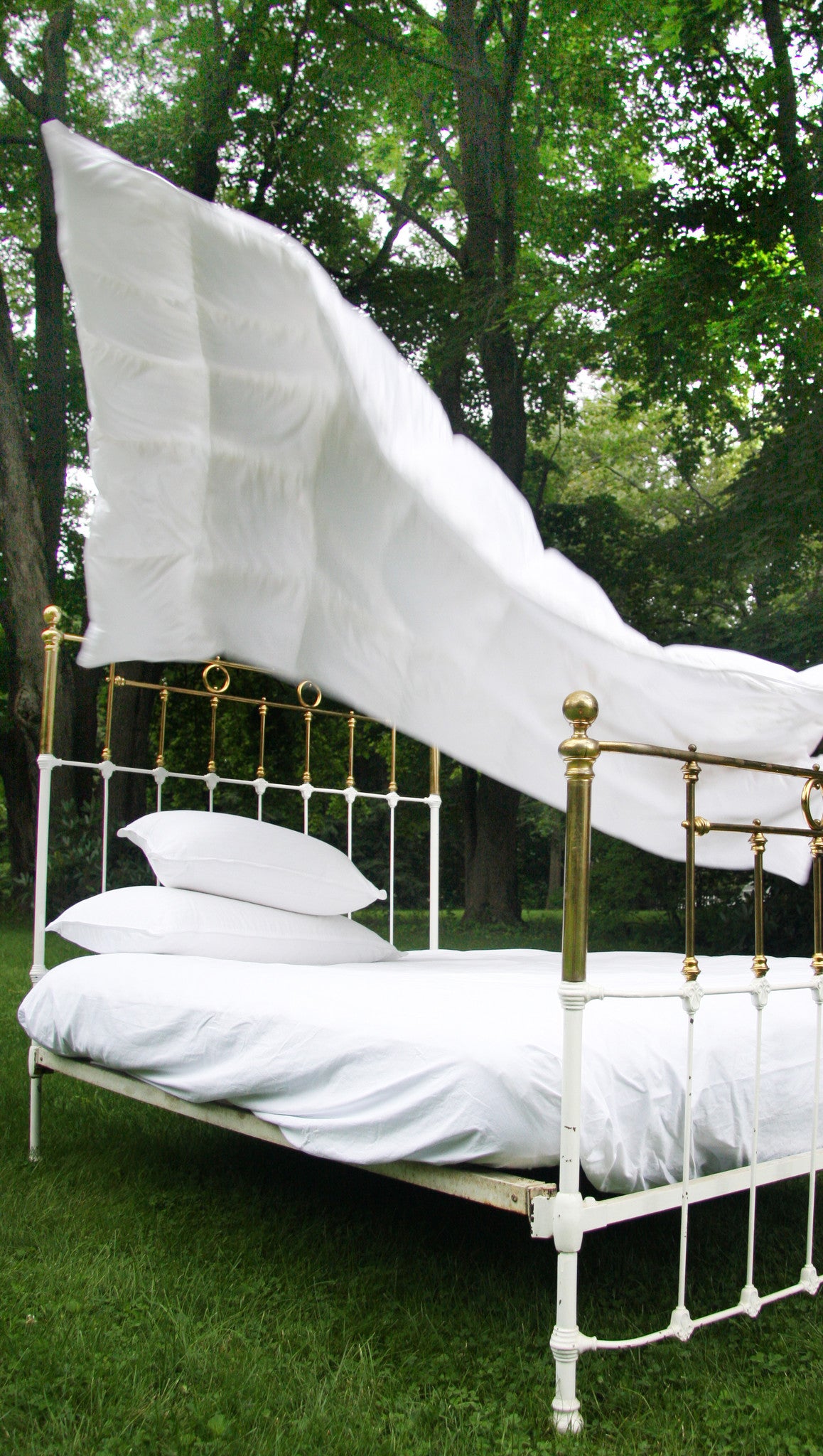 Au Lit Duvet Being Fluffed in the Woods
